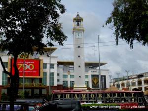 Padang Besar bus waiting in front of the clock tower in Hat Yai