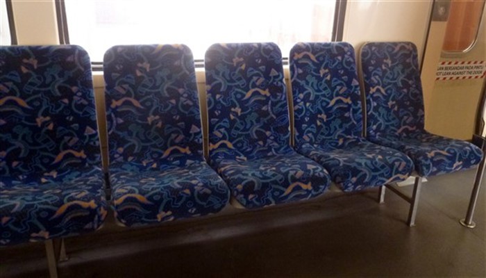 Seats on a commuter train from Taiping to Penang Sentral Butterworth